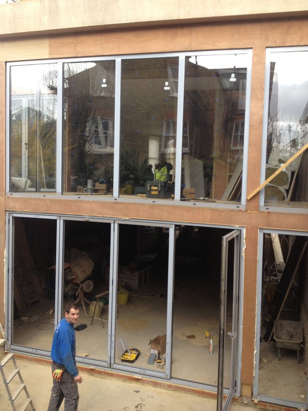 Aluminium bi-fold doors with two-storey glazing in Charlton