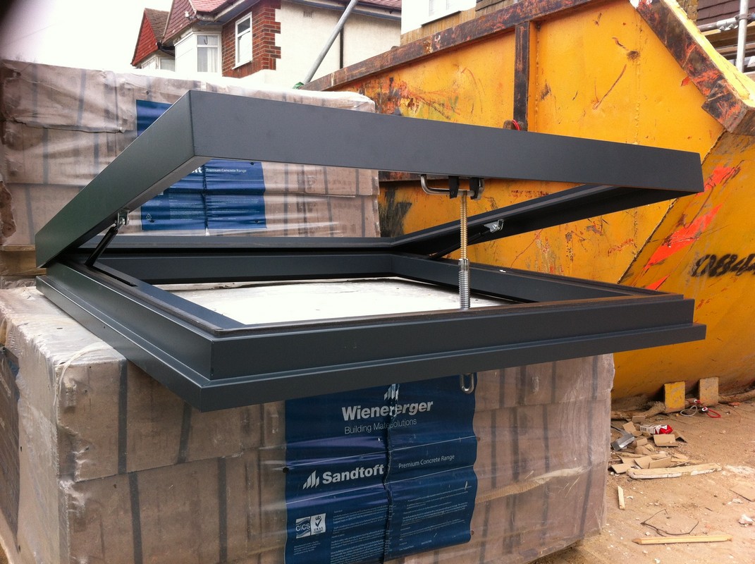 Opening flat roof skylight in anthracite grey installed in Charlton
